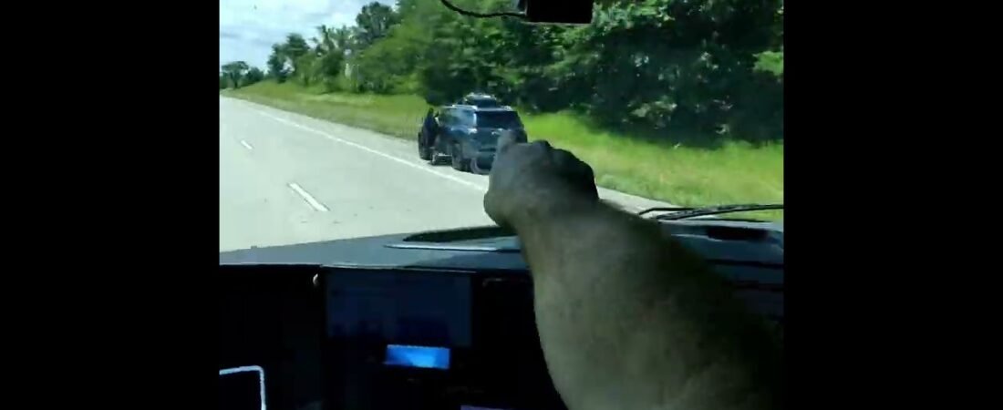 SUV OPENS FIRE AT TRUCK DRIVER! Highway dangers of driving a Big Rig in a Major City! Always Duck!