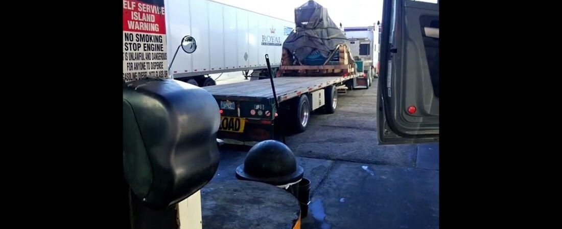 Trucker tried to get a shot of the REAL SPACE SHIP hiding under a tarp at the truck stop.