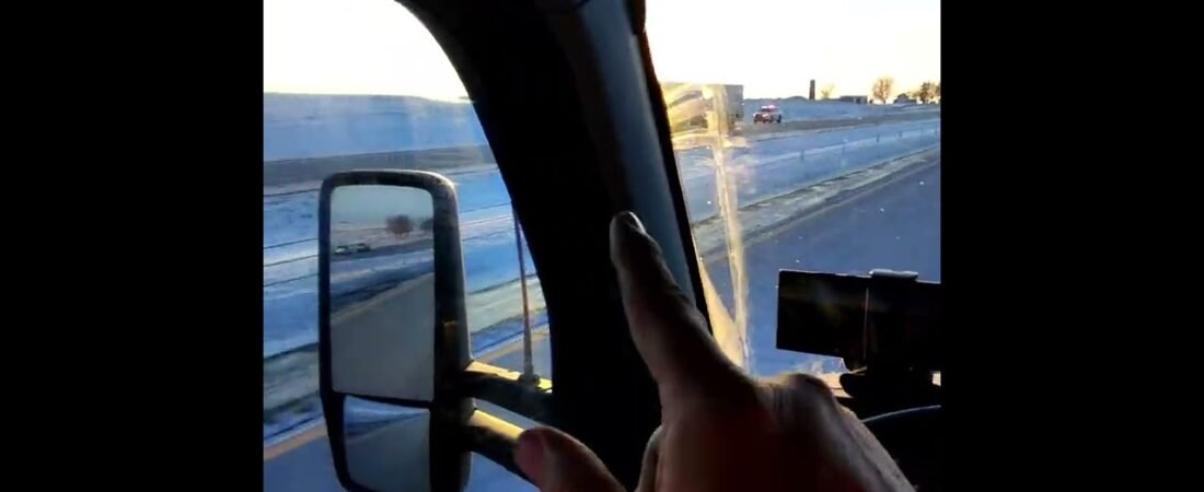 TRUCKER is driving in the fast lane speeding while holding a camera recording NOTHING for YouTube.