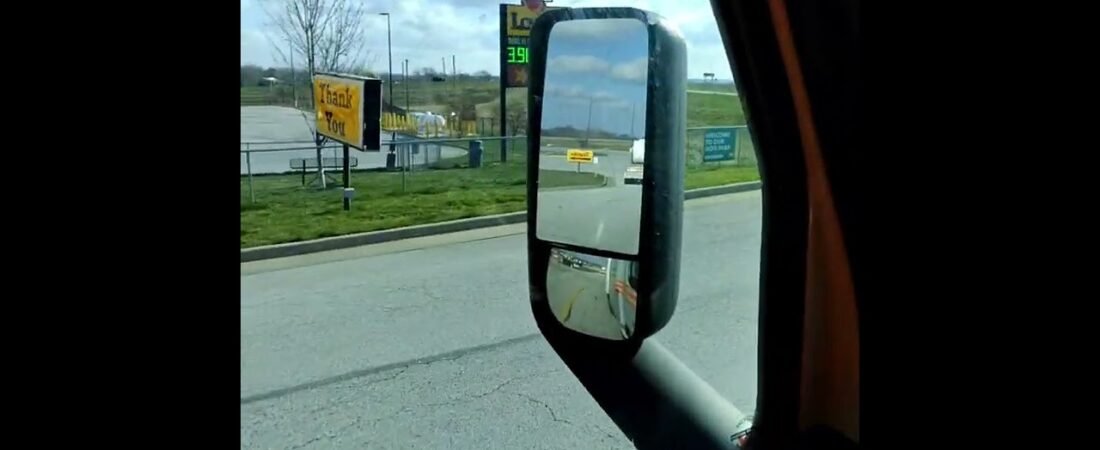 Angry Trucker drags trashcan across truck stop. Welcome to America. Living the American Dream.