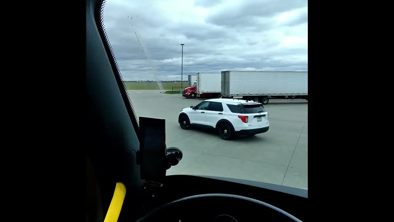 Cops creeping through Truck Stop. What is he doing? Does anyone know? Are we safe. They are coming.