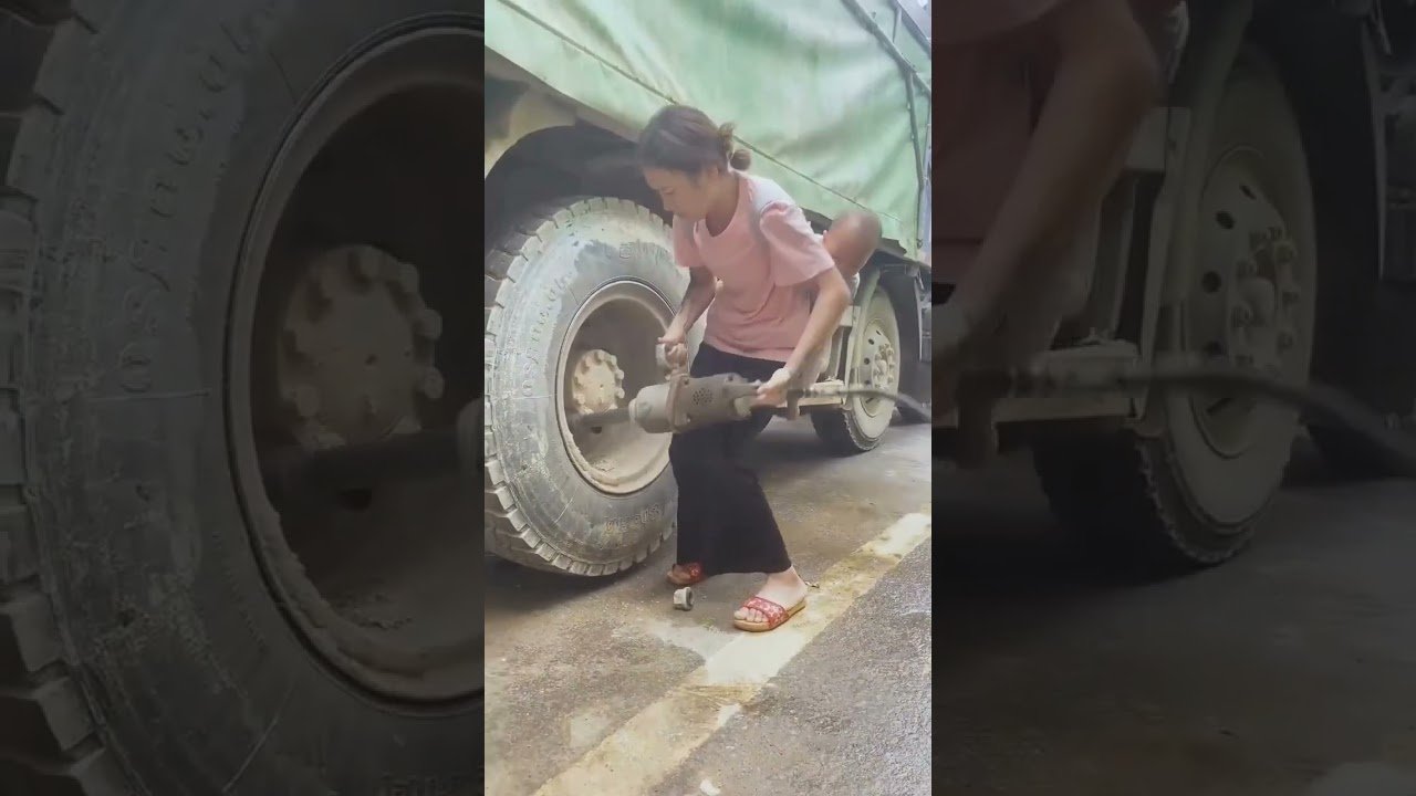 Lady changes Big Rig Tire without getting dirty! That’s how you know it’s real.