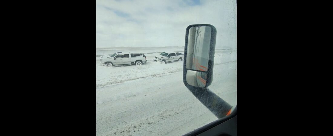 Pickup Trucks slid off the highway together. It’s so icy out here on the open road.
