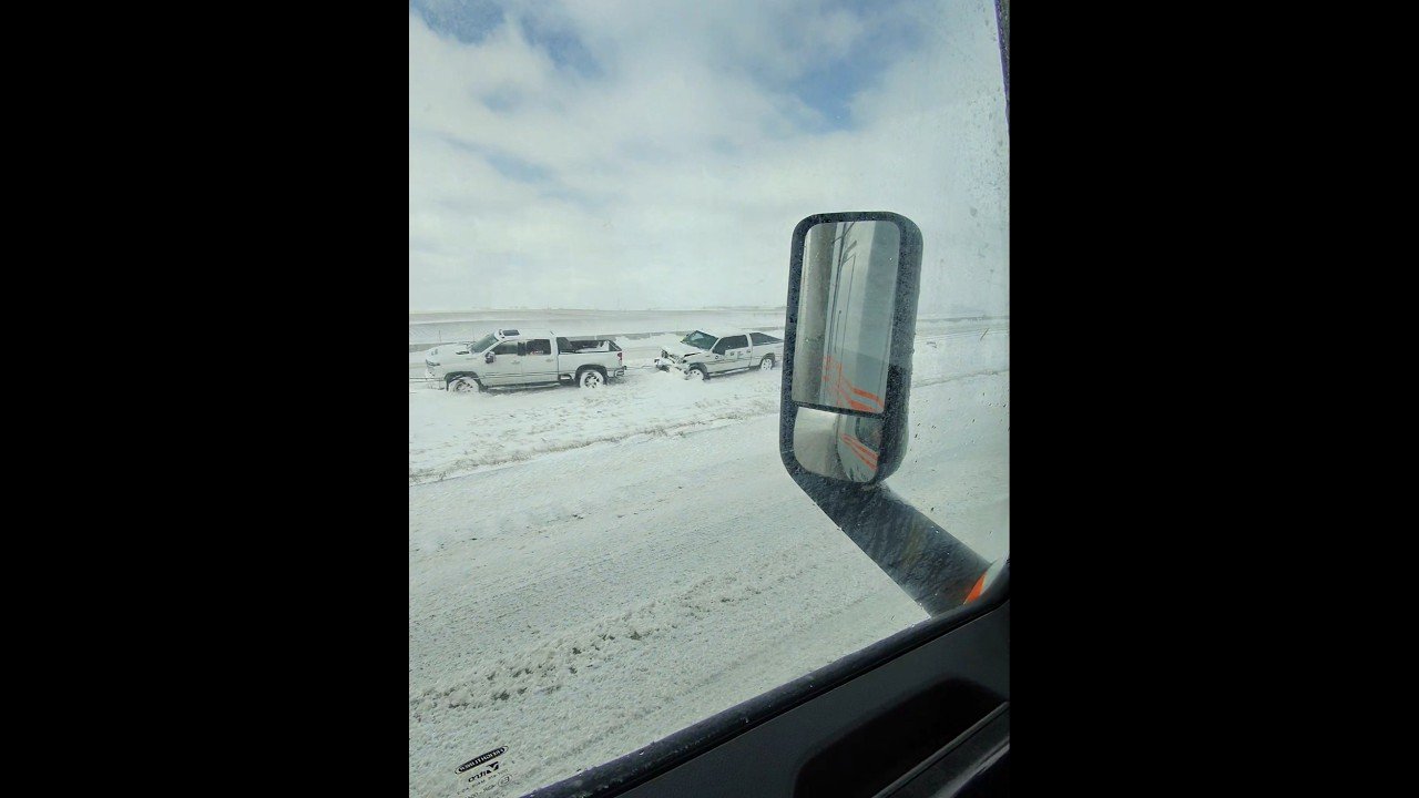 Pickup Trucks slid off the highway together. It’s so icy out here on the open road.
