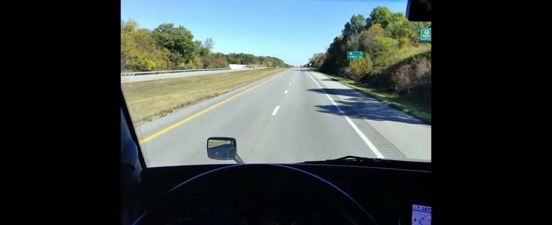 Setting the cruise control in a semi truck going full speed.