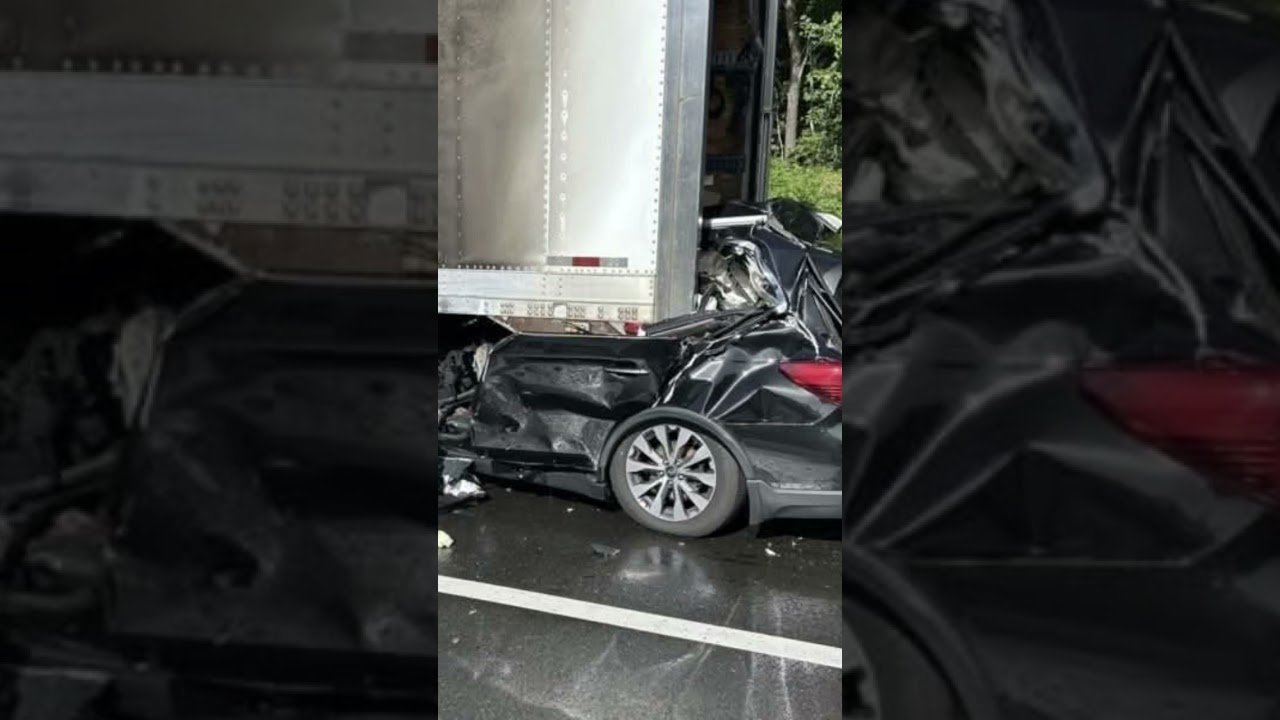 TRUCKER SLEEPING ON THE SHOULDER OF THE HIGHWAY.