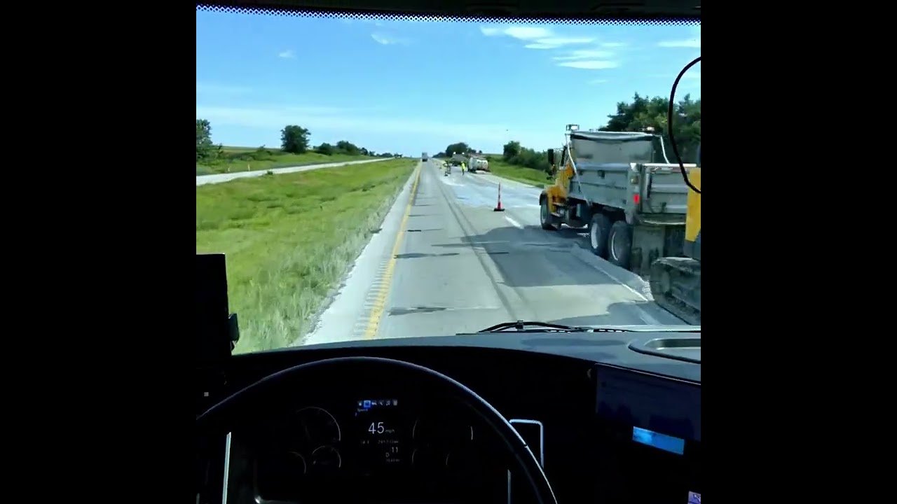 The dude is standing ON THE HIGHWAY. How crazy is this? How is this safe for anyone. .