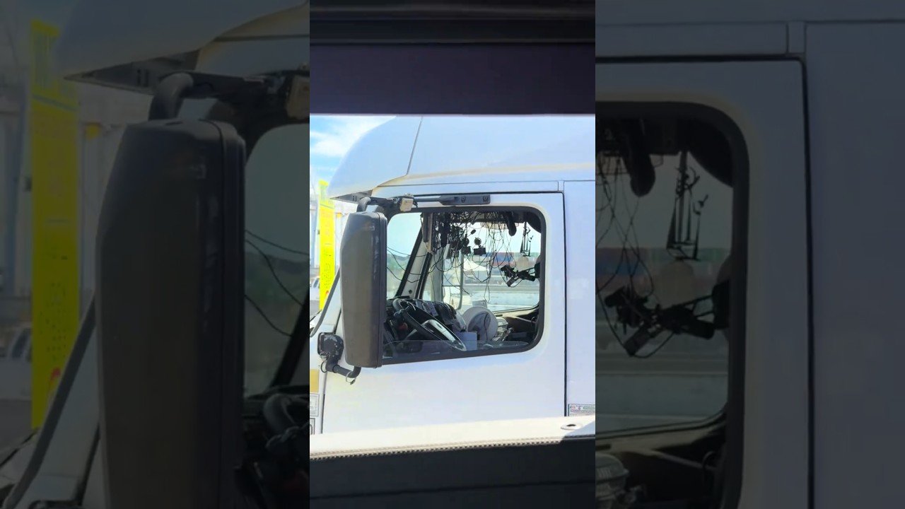 This TRUCKER is doing everything except driving!