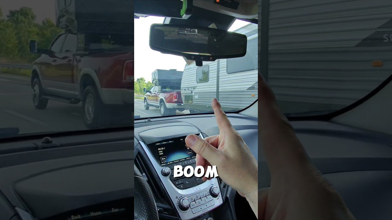 This pickup truck has a BOOM BOOM room on top of it.
