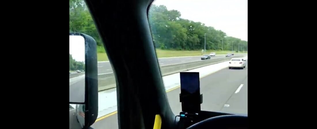 What is this trucker doing while driving? How is this legal in any state? We have to stop this.