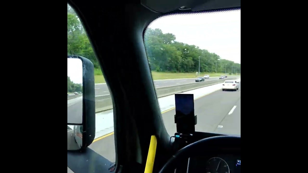 What is this trucker doing while driving? How is this legal in any state? We have to stop this.
