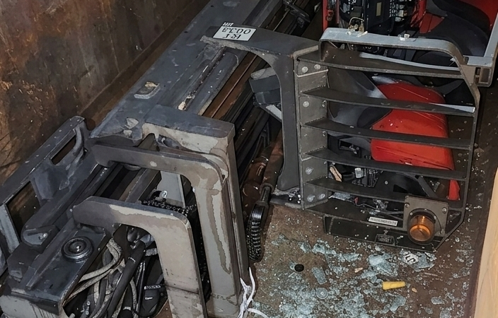 DISGRUNTLED DOCK WORKER DROVE HIS FORKLIFT INTO THE DUMPSTER BEFORE QUITTING HIS JOB.
