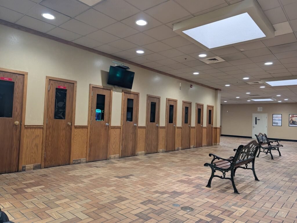 WHY DO THESE SHOWERS HAVE WINDOWS AND WHY ARE THERE CUCK CHAIRS???